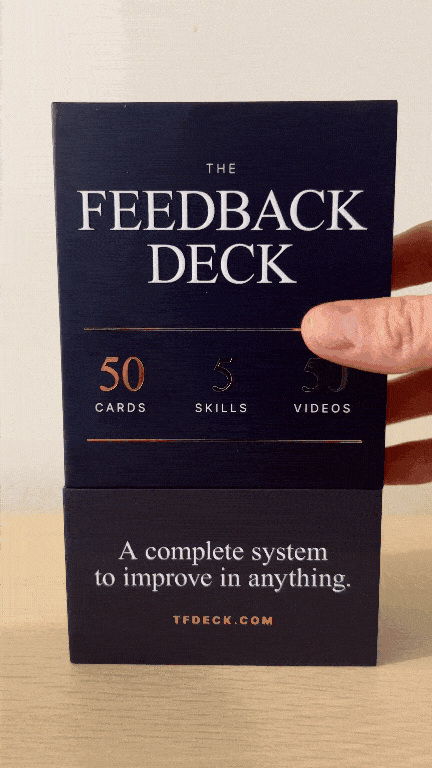 The Feedback Deck — the lid lifting to reveal five suits: Seek, Receive, Process, Use, Give